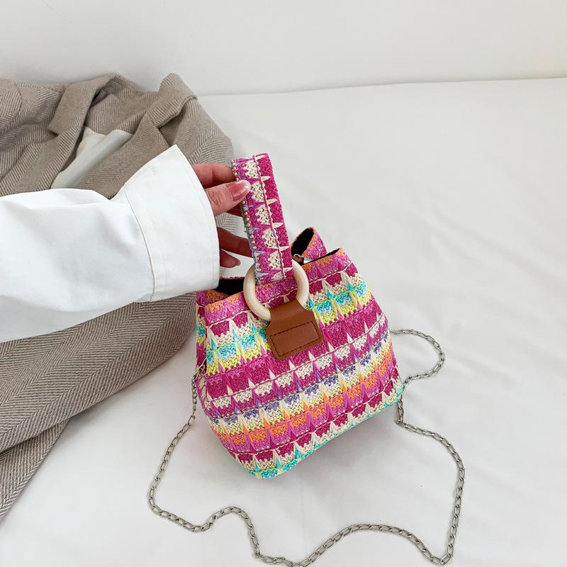 

2025 spring new woven bucket bag chain bag casual armpit bag versatile straw woven shoulder oblique span bag розовый