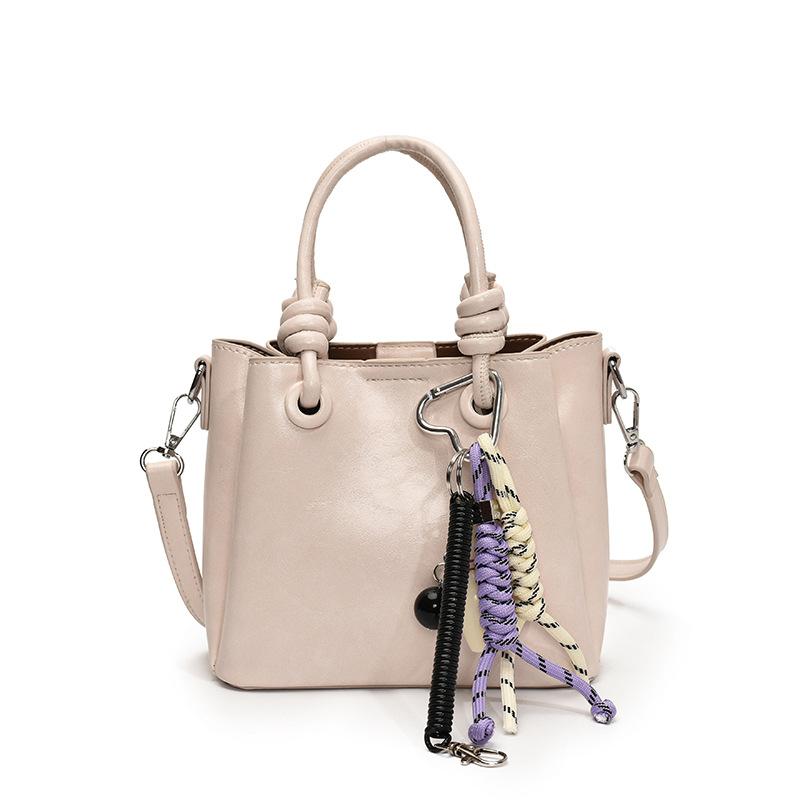 Trendy new products niche simplicity high sense Korean version sweet portable bucket bag versatile commuter foreign style messenger women's bag