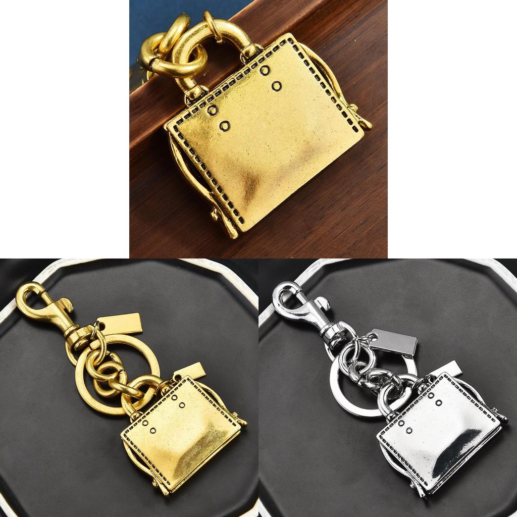 Metallischer Schlüsselanhänger Taschenanhänger Mit Graviertem Buchmuster Für Modeaccessoires