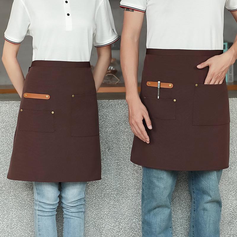 Unisex vanntett kjøkkenforkle i kanvas med halvlangt design og logo i midjen