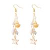 Exquisite Boucles d'Oreilles à Pompons Coquillage & Étoile de Mer pour Femmes – Polyvalentes, Style Bord de Mer de Niche