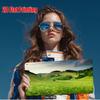 The Models Aviator Sunglasses Reflect the Exact Natural Landscape Shown On the Rectangular Print She Holds Vividly Demonstrat