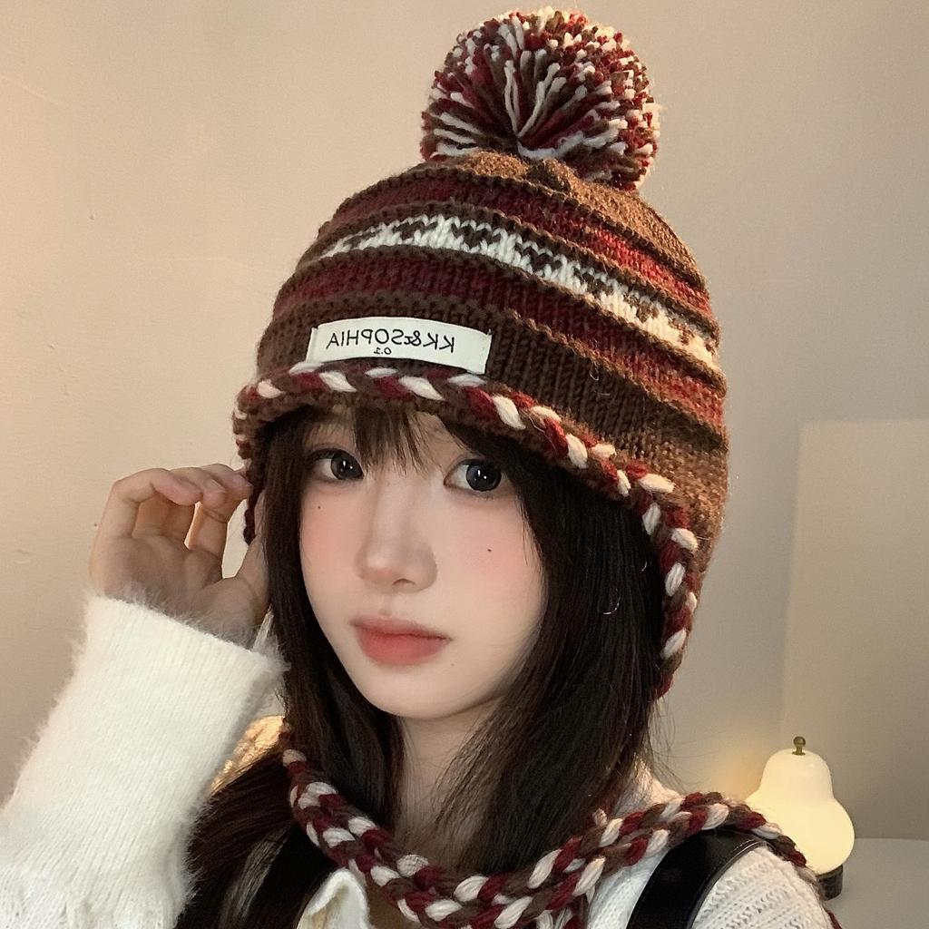 Cozy Chic Knitted Winter Hat For Women Featuring Colorful Pom Poms And Warmth