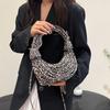 Personalized leopard print bag women's 2025 new European and American fashion niche versatile women's one-shoulder hand-carried noodle woven bag