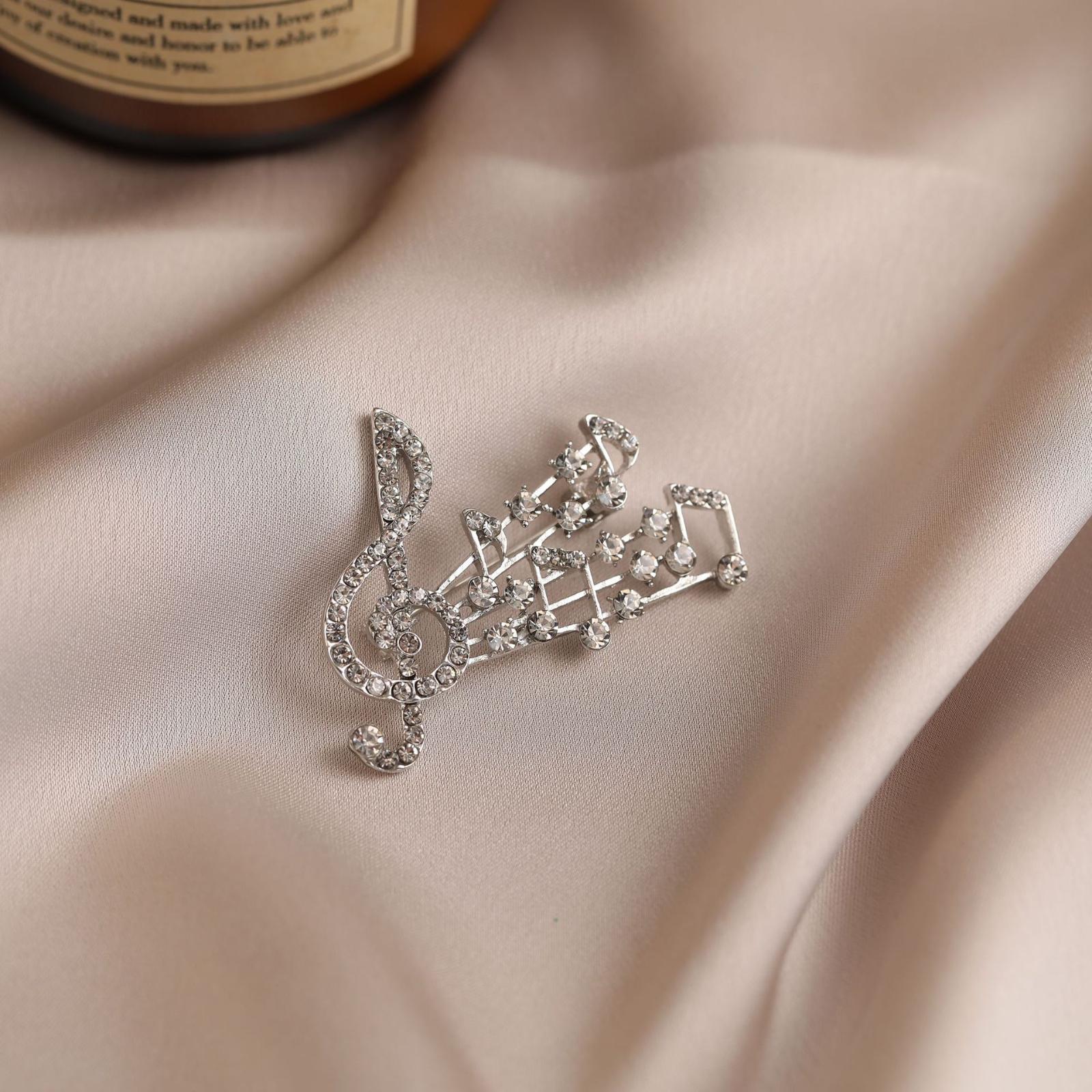 Элегантная и утонченная брошь в виде музыкальной ноты из сплава, инкрустированная бриллиантами, для женщин. One Size