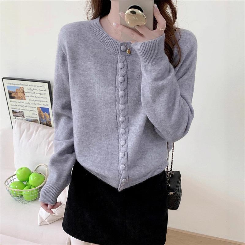 Autumn new solid color round neck single-breasted splicing long-sleeved knitted sweater women's fashion age-reducing top