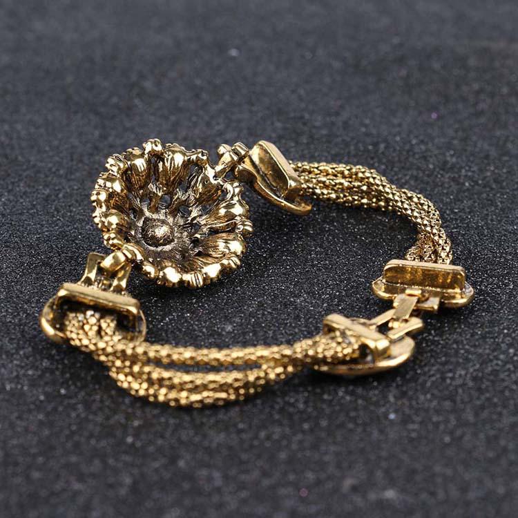 Vintage Blumenarmband mit vergoldeter Schlangenkette und Harz-Strasssteinen