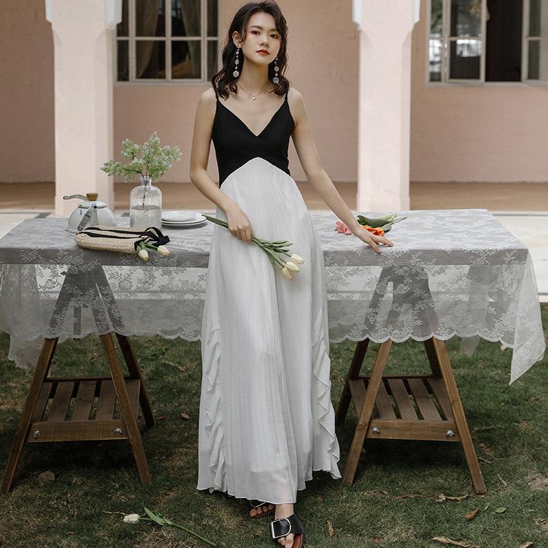 French niche retro black and white splicing irregular ruffle edge super fairy suspender dress women's vacation pleated long dress
