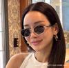 New oval metal retro sunglasses for women, high-end brand no-makeup street style European and American sun-protective sunglasses