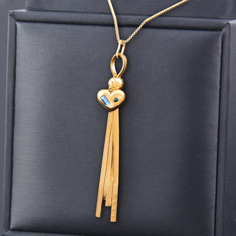 Chaîne de clavicule pendentif fluide en titane et acier doré