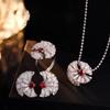 Xiaohongshu-Endorsed Camellia Jewelry Set: Simulated Topaz Necklace, Ring, and Earrings with Full Red Diamond Design.