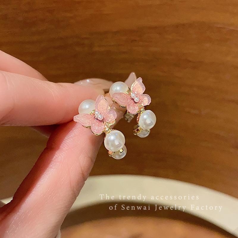 In the wind pearl bow earrings female sweet temperament super fairy high sense stud earrings Korean versatile Internet celebrity earrings