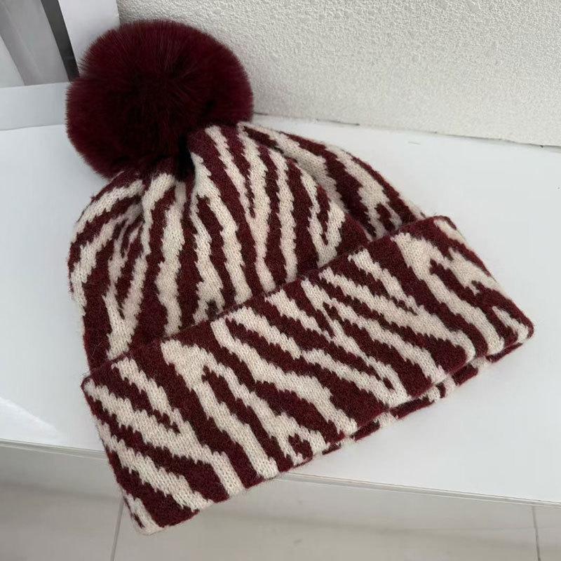 Zebra pattern hairball knitted hat women's autumn and winter retro versatile face small wool hat cold-proof warm ear hat