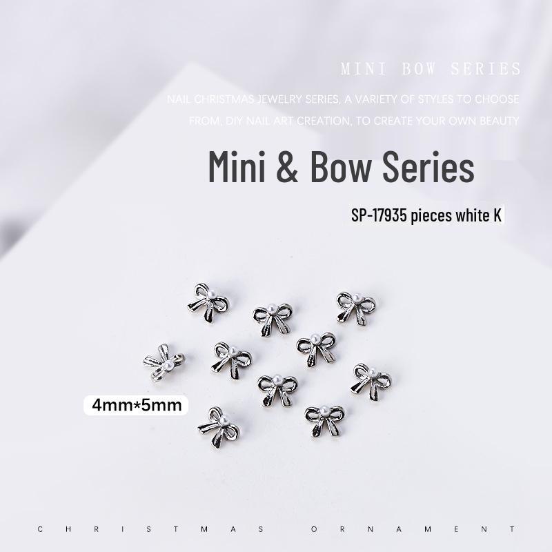 

Набор 3D украшений для ногтей с жемчужными бантиками - 5 мини-металлических бантиков