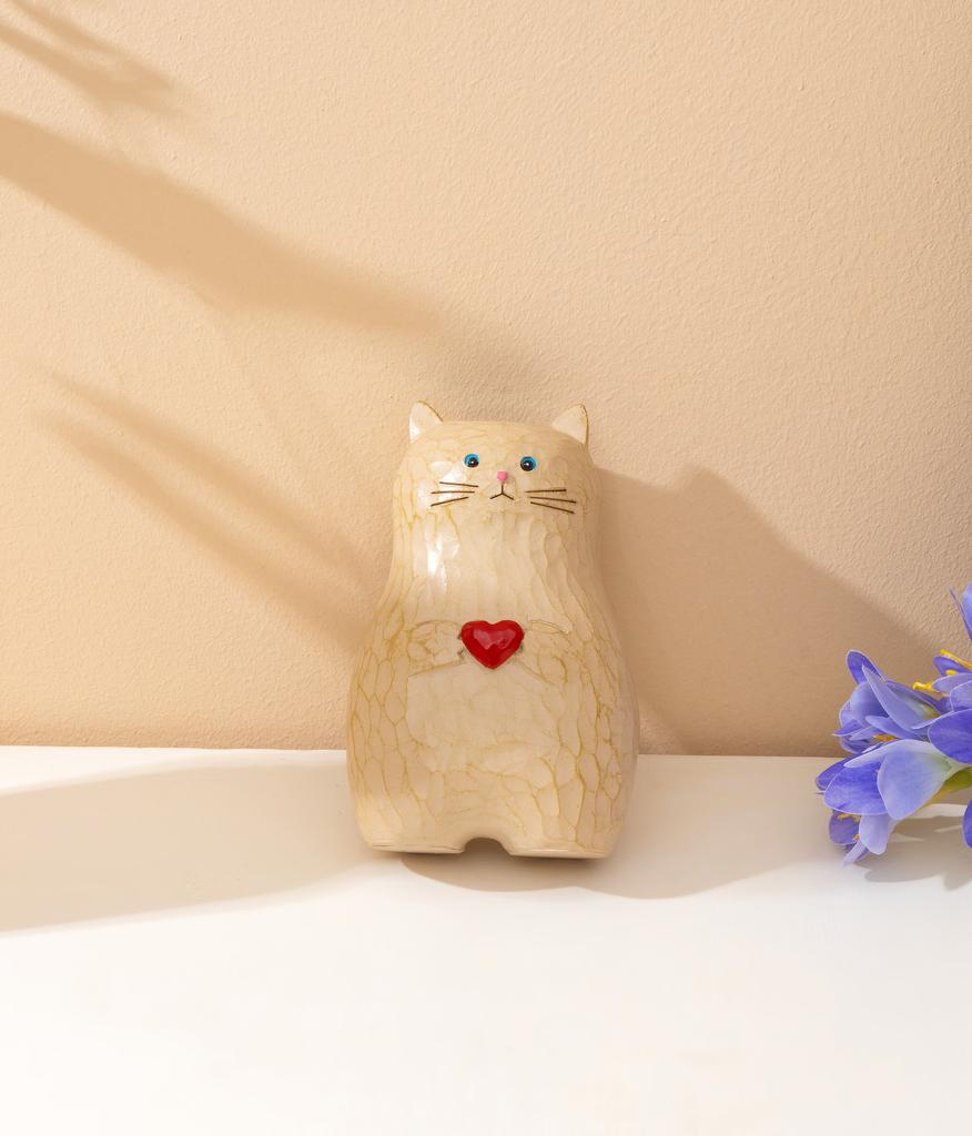 A cat shaped storage pen holder with heart-shaped decorative statues and multifunctional vase decorations