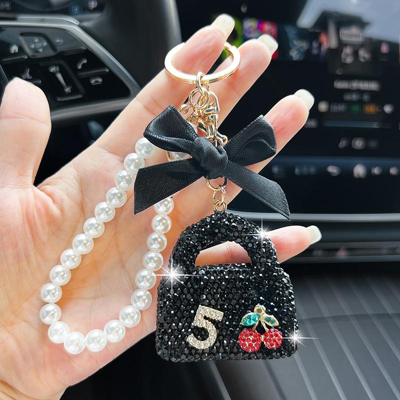 

Bling Mini Handbag Keychain, Sparkling Zircon Purse Charm with Bow ,Luxury Zircon Mini Bag Keyring, Cherry & Number 5 Design with Satin Bow чорний