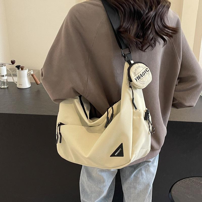 

Fashion new versatile casual large-capacity canvas bag women s simple dumpling bag high-end trend messenger bag