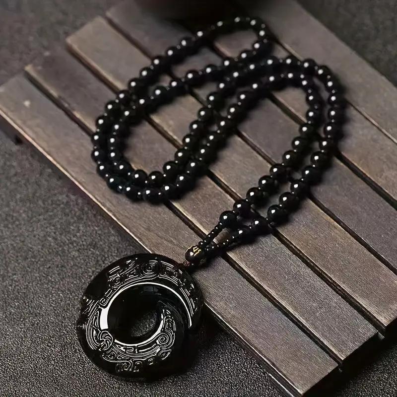 Přívěsek z černého obsidiánu: Elegantní design přírodního kamene pro muže