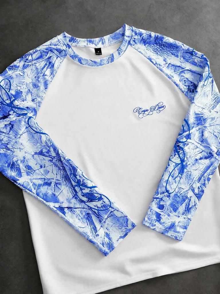 T-shirt a manica lunga raglan must-have con maniche fantasia ed elegante ricamo per uno stile casual.