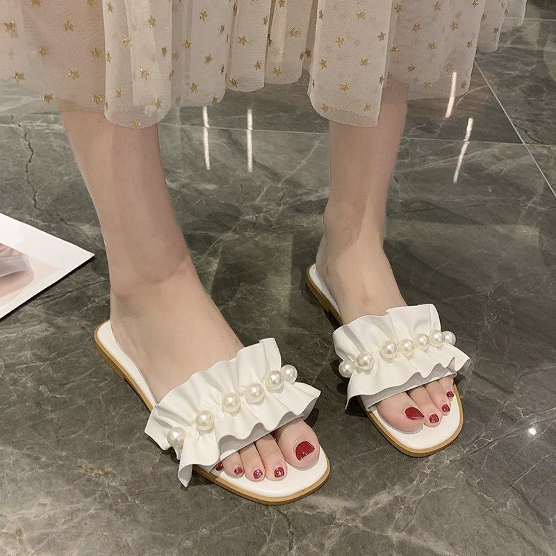 Cool slippers women's summer outer wear ins tide 2025 new fashion fairy wind sweet pearl flower flat bottom one-word drag