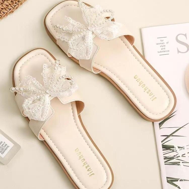 Fairy wind bow pearl slippers female 2025 summer new Korean version of Internet celebrity flat bottom square head cool slippers