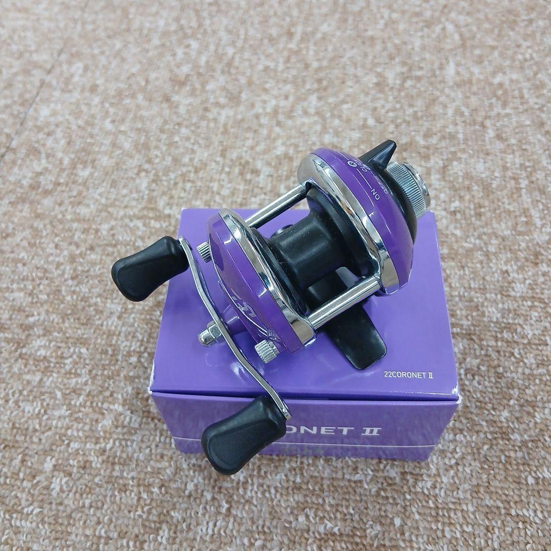 Used Daiwa CORONET II bait reel purple