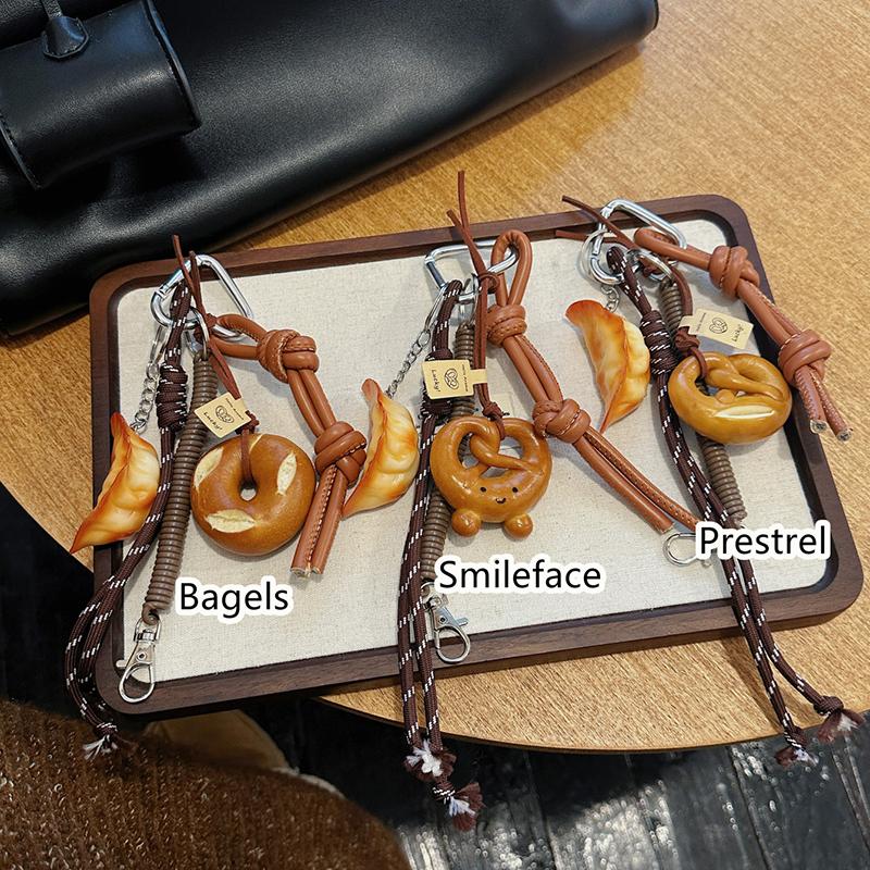 Yogodlns Cute Smiling Face Bread Woven Rope Dumpling Pendant Bag Accessory Handmade Trendy Bag Hanging Alkali Water Bread Bagel Bag Pendant