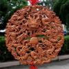 Nine Dragons Peach Wood Pendant: Hand-Carved Hanging Ornament for Home Entrance or Living Room Decor.