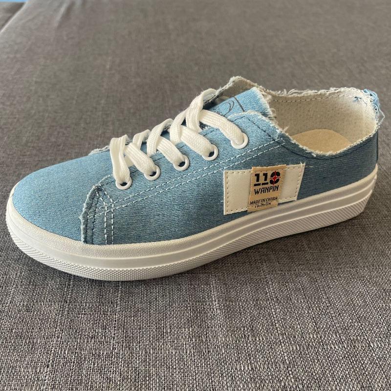 Canvas shoes female students spring new semi-drag lazy one pedal versatile breathable large size white shoes board shoes