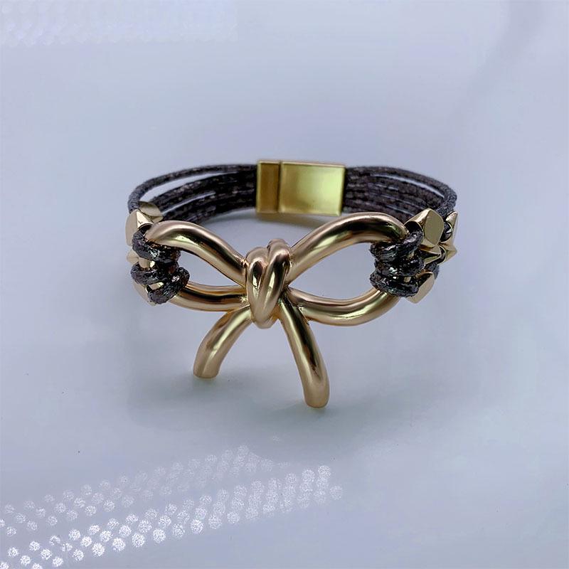 Modna europejska i amerykańska skórzana bransoletka z magnetycznym zapięciem w kształcie kokardy - Modna biżuteria damska na Boże Narodzenie