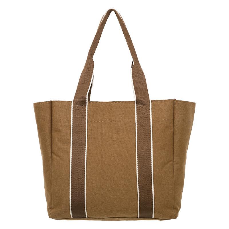 

New canvas simple shoulder bag women s fashion travel portable messenger bag large capacity premium tote bag One Size коричневый
