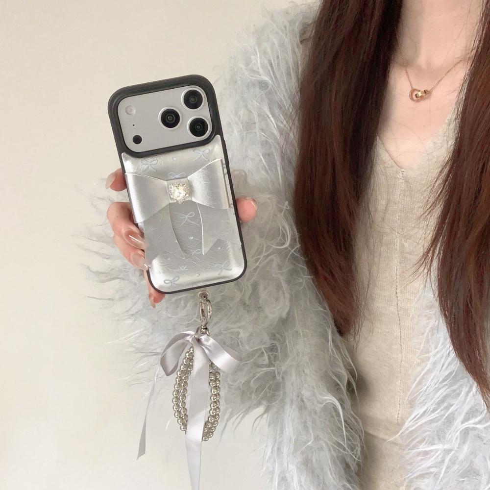 Korean ins silver leather three-dimensional bow, suitable for Apple 17 mobile phone case, new iPhone17promax high value 15 trend 14 flash diamond 13