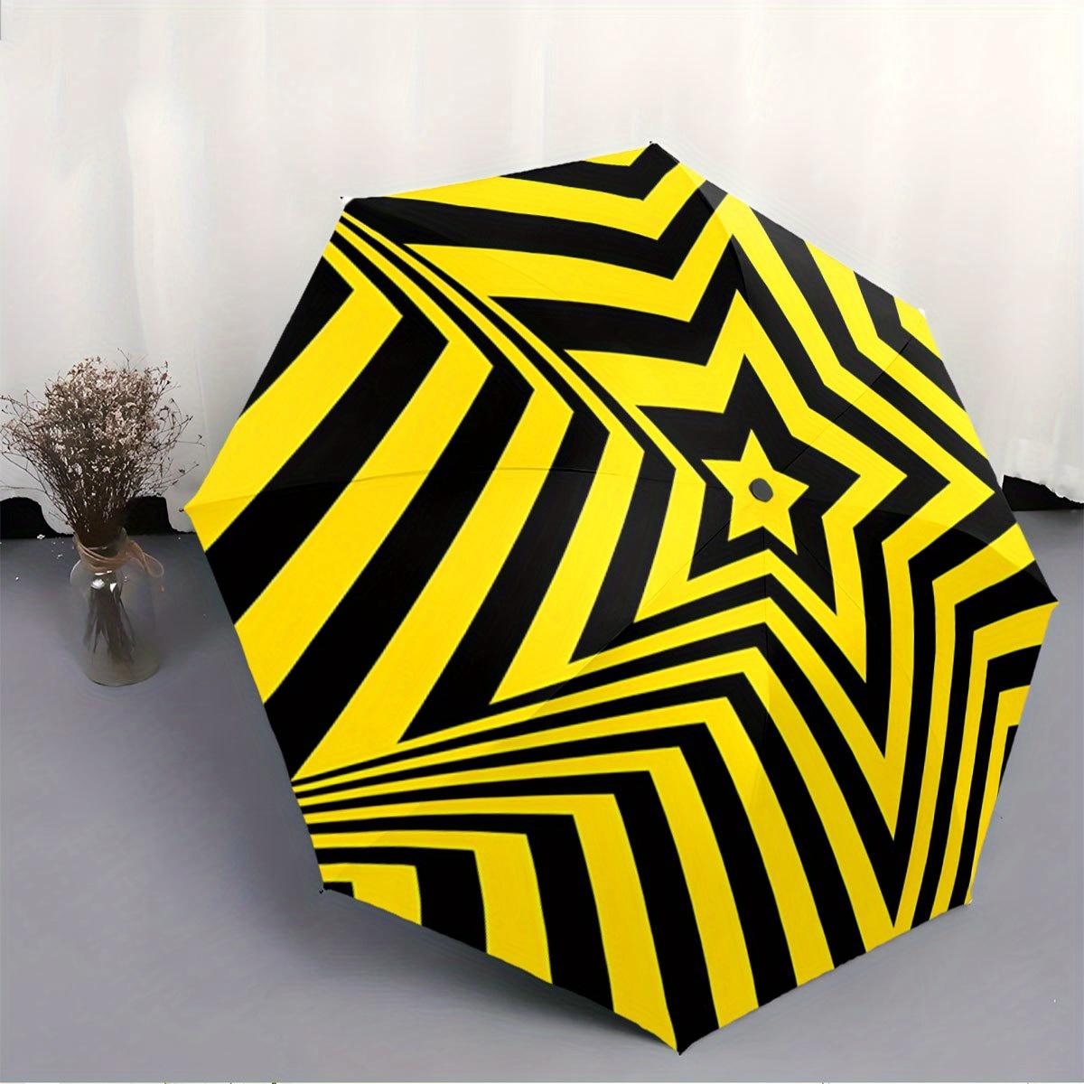Folding Umbrella The umbrella features a bold star pattern with alternating yellow and black stripes. Fits Travel,Backpack,H