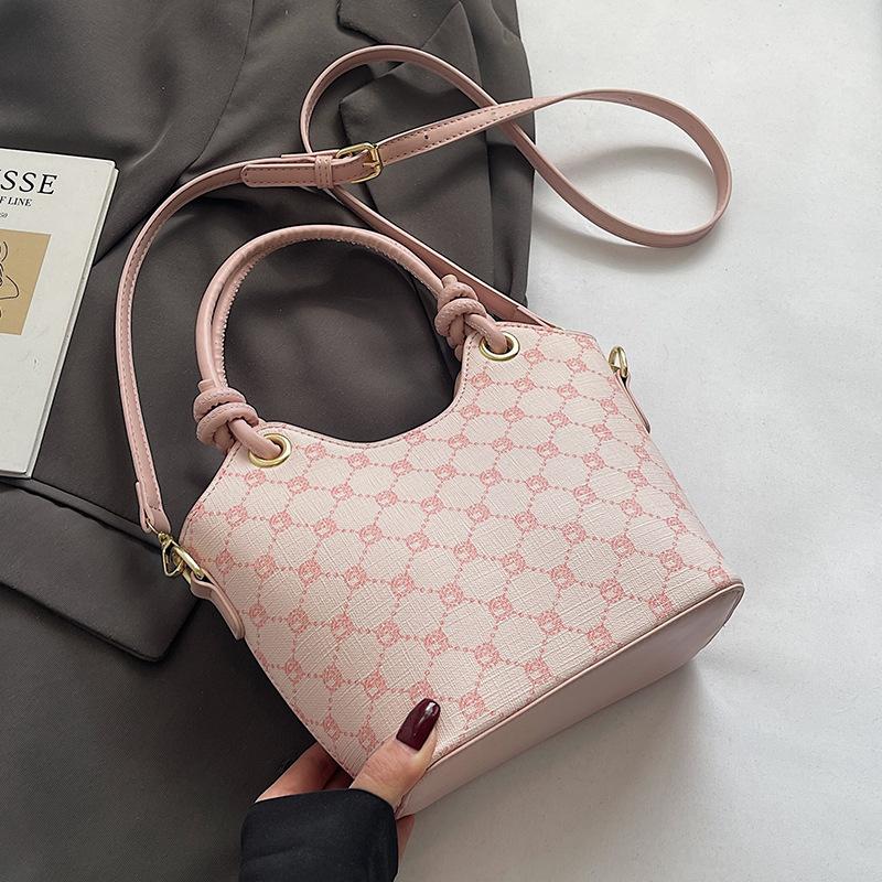 Korean version of trend, high-end printing temperament, portable bucket bag, niche fashion commuting versatile light luxury messenger bag, women