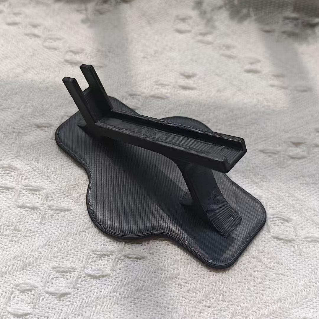 

Ergonomic 3D Printed Flexible Phone Holder for Desktop Binge-Watching Black Side-Lying Phone Holder