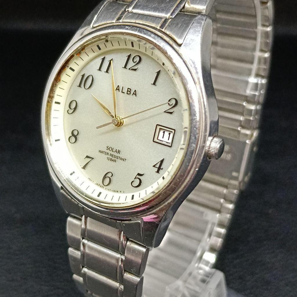 Used Working condition: ALBA men's wristwatch, solar-powered, date display, 10 bar water resistant