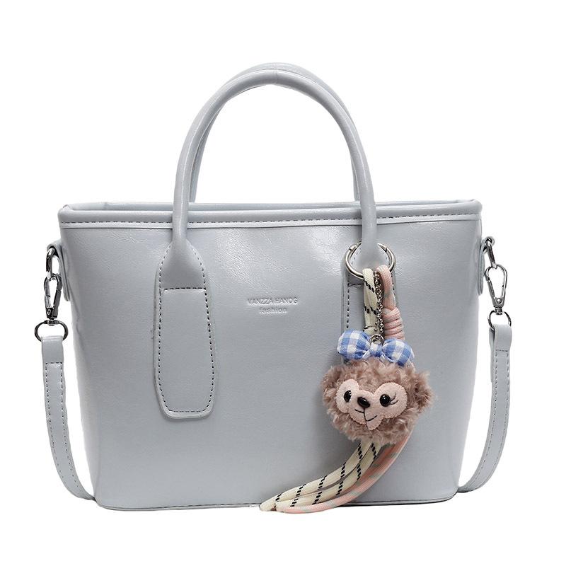 New High-end Korean Version Hugh Simple Portable Bucket Bag Versatile Commuter Fashion Niche Messenger Bag Bag Woman