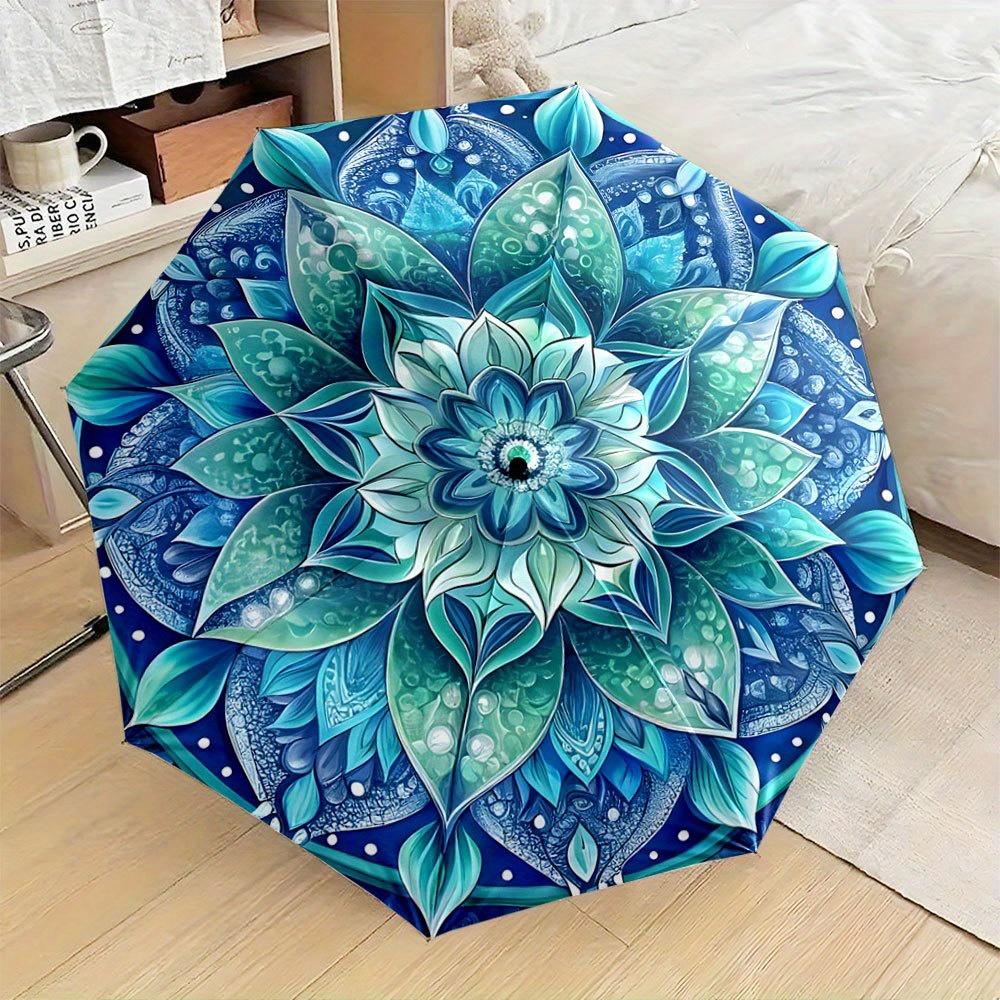 

Folding Umbrella The umbrella features a vibrant mandala design with intricate blue and green leaf patterns radiating from the (as the picture,Iron&8K)