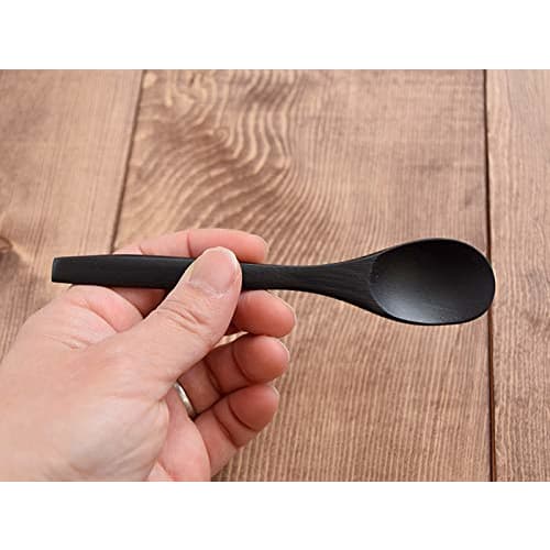 Stylish and smooth to the touch, this oval (black) bamboo spoon is a must-have.