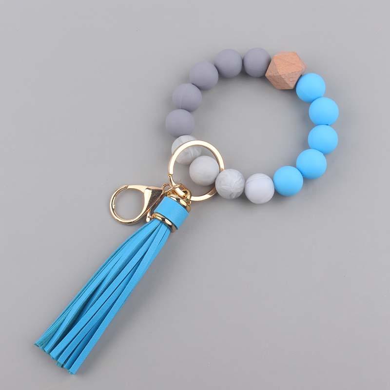 Bracelet en Silicone, porte-clés, pendentif en cuir PU, pompon en