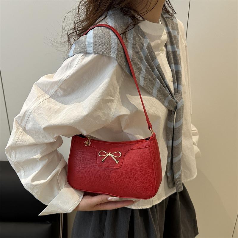Solid color fashion bow new trendy texture commuting shoulder underarm baguette bag women
