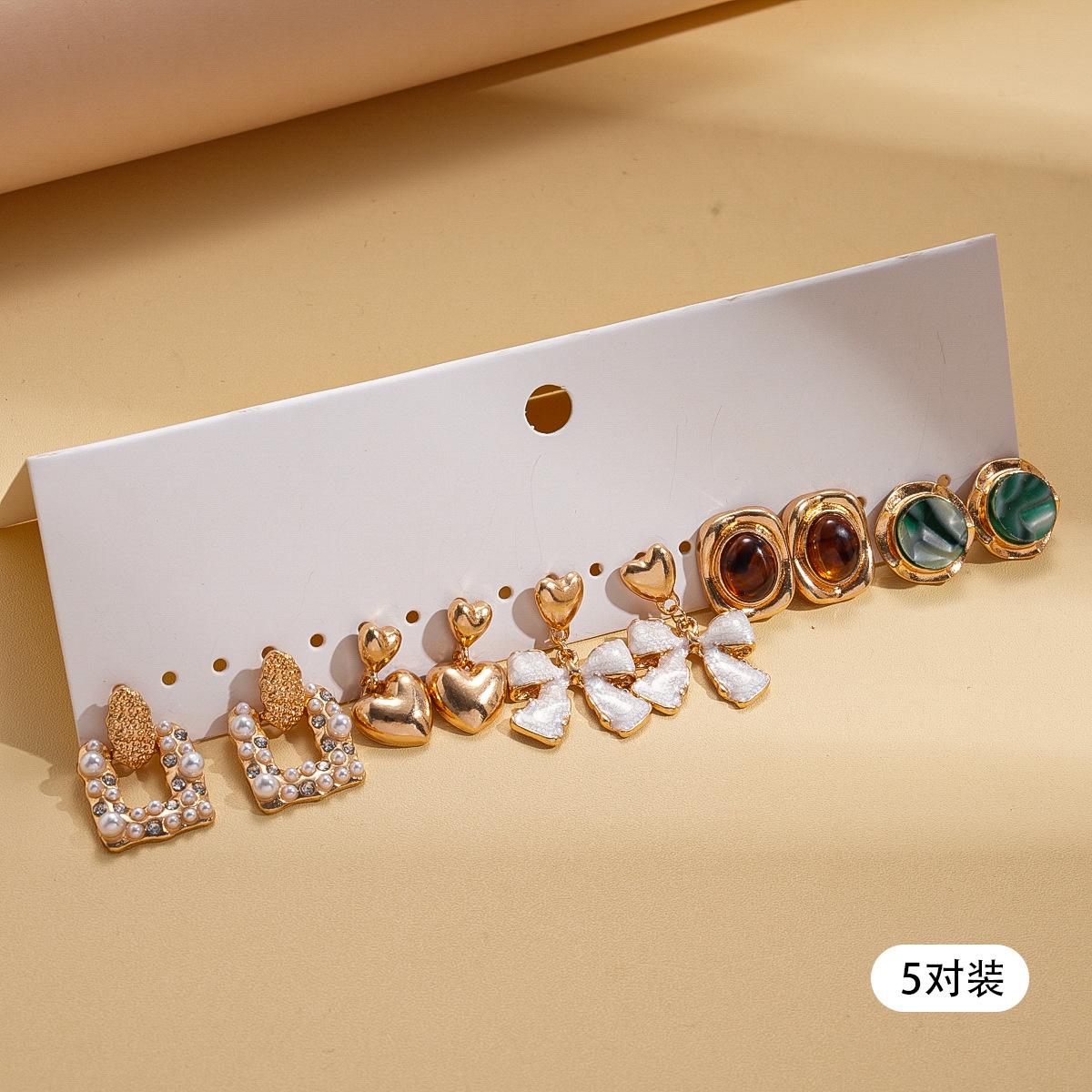 

Ten-piece set of European and American diamond-encrusted resin imitation pearl bow silver needle retro elegant earrings