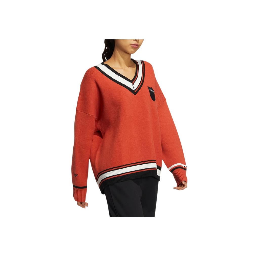 adidas Originálny pletený vianočný sveter s výstrihom do V a vyšívaným logom pre ženy, oranžový HS9520