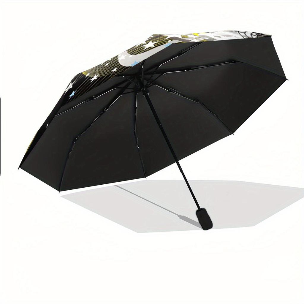 Folding Umbrella The umbrella features a soccer ball as the main design, with star patterns and curved yellow streaks. Fits Tr
