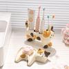 Three-flower Cat Electric Toothbrush Rack Rack Couple Toothpaste Placed Washstand Base Bracket Ceramic Holder Bathroom Supplies