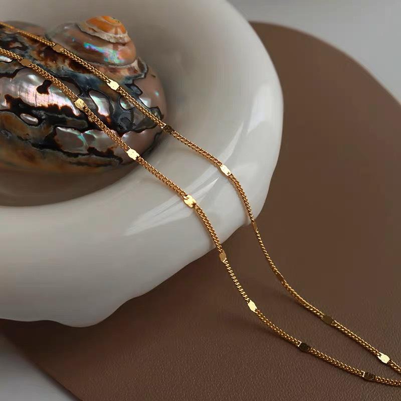 18K Gold-Plated S925 Sterling Silver Necklace for Women - Minimalist Layered Clavicle Chain with Sparkling Flakes, High-End Luxury Design.