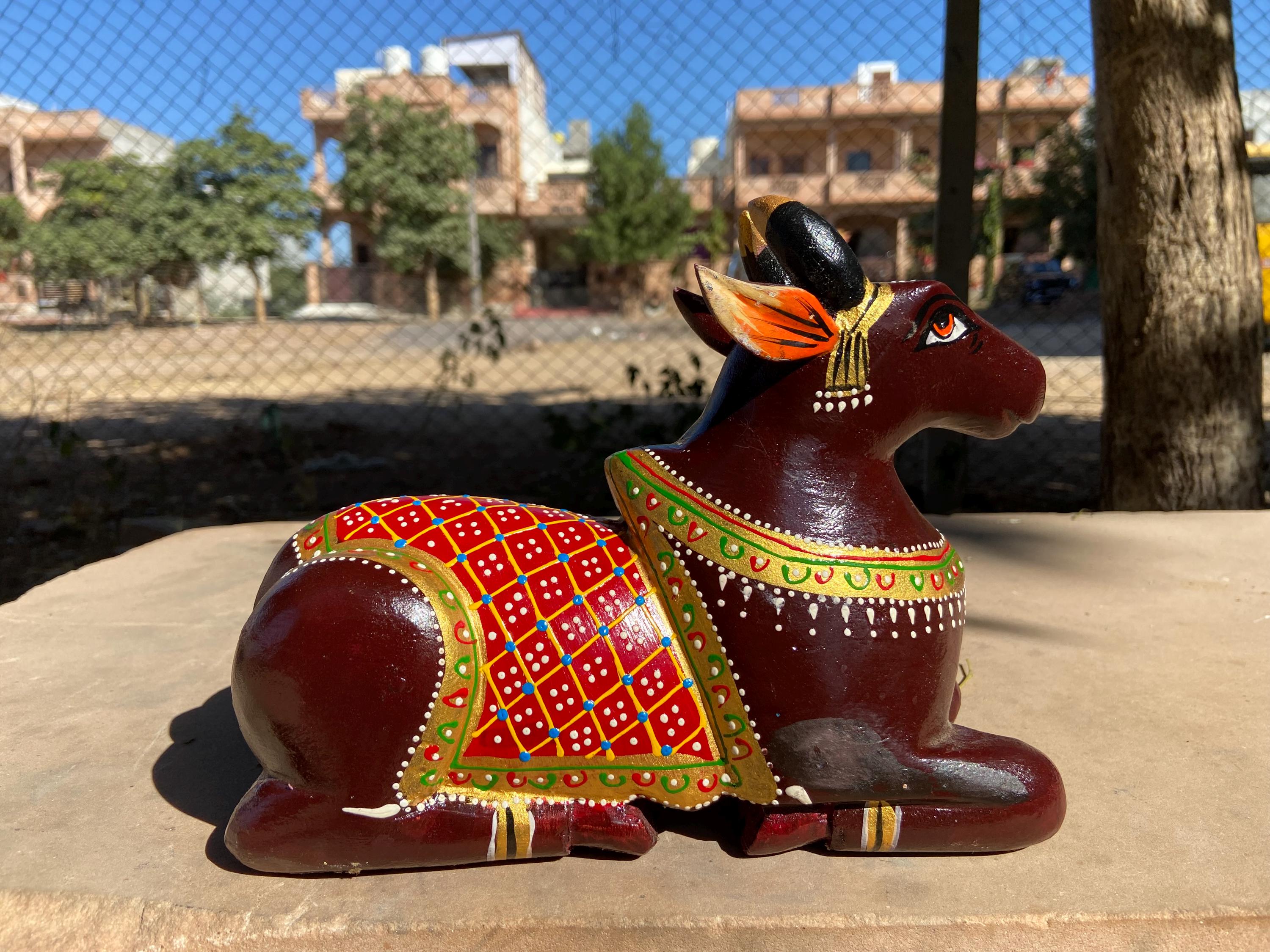 

Hand-Painted Wooden Nandi Bull Statue: Indian Religious Decor 16” X 8” X 24” (l x w x h) разноцветный