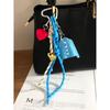 It is the same niche design PU blue shirt pendant keychain love braided rope versatile bag pendant accessories.