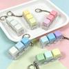 Sleutelhanger voor stressverlichting: Decompressie Kubus met Vier Knoppen & Toetsenbord Hanger
