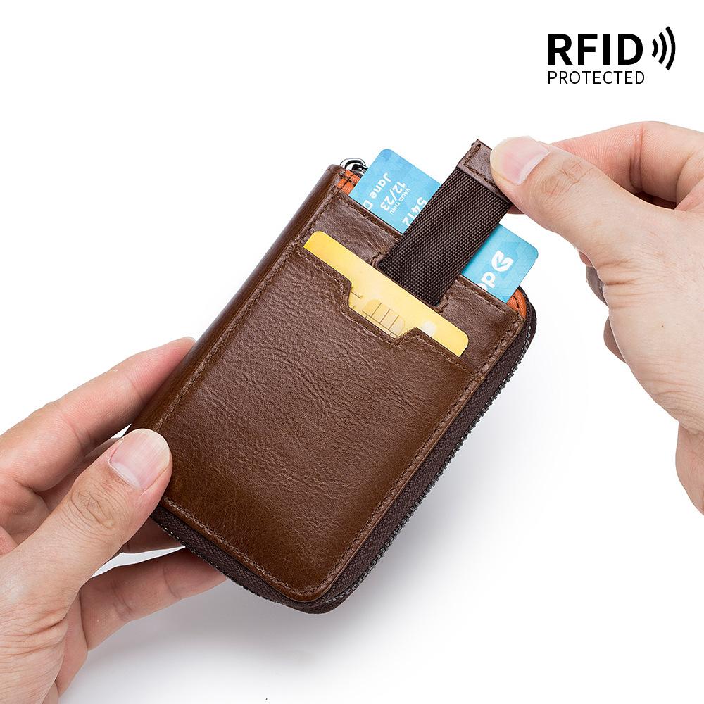 The First Layer of Cowhide Retro Men's Short Change Bag, European and American Vertical Dollar Clip, RFID Multi-card Pumping Card Bag.